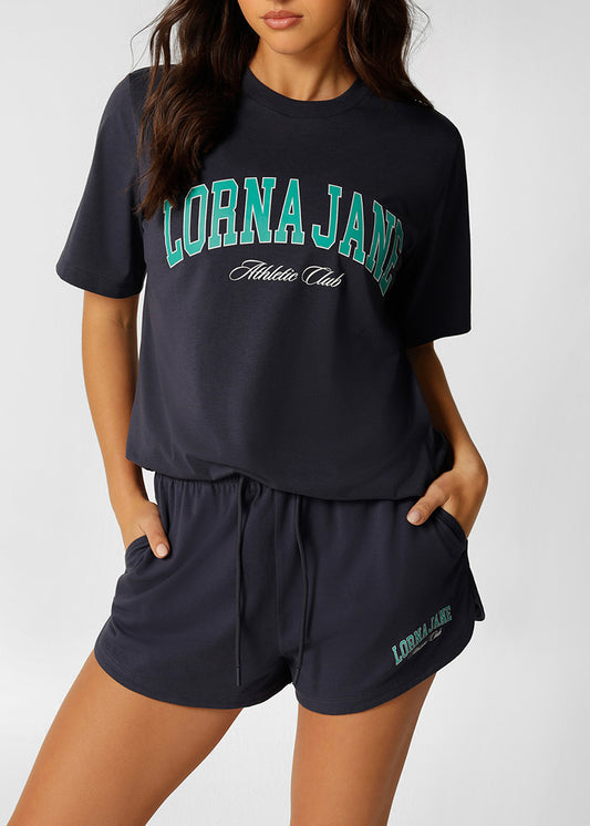 ﾗｽﾄ1点 ﾛｰﾅ 092550 ｵﾘｼﾞﾅﾙ ｽﾎﾟｰﾂ ﾘﾗｯｸｽﾄﾞTｼｬﾂ PLATINUM NAVY